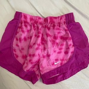 Pink swim shorts.